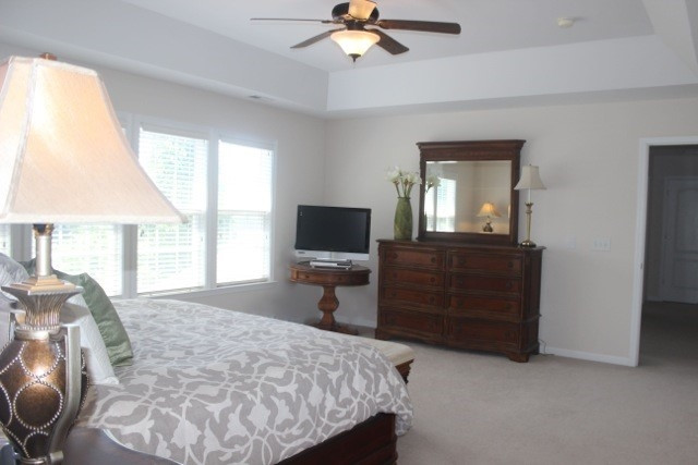7729 Silver View Lane Raleigh, NC 27613 - Photo 13 of 25 Lots and lots of space in your master bedroom with a trey ceiling, ceiling fan, and plenty of windows to let the light in on those gorgeous NC mornings! Master bedroom