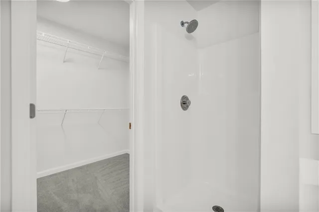 a view of a swimming pool with a patio and a fountain