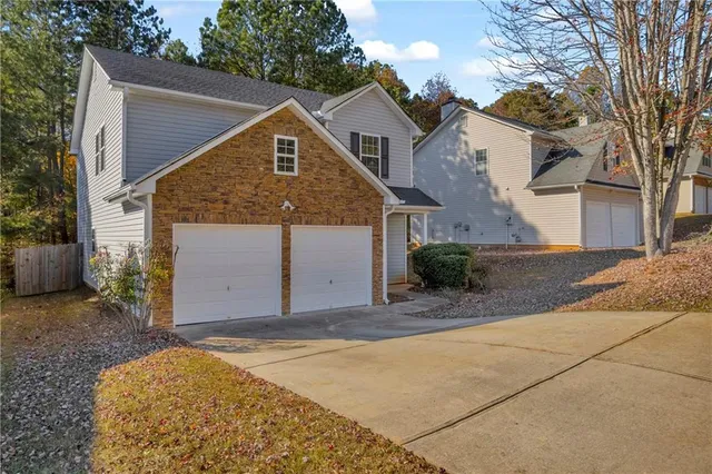 an aerial view of residential houses with city view and mountain view