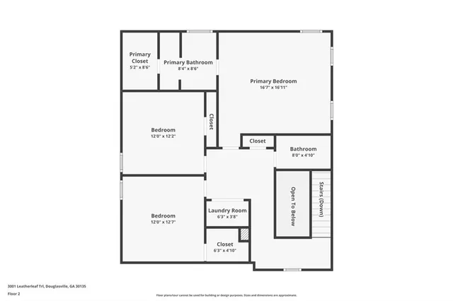 a white toilet sitting next to a white wall