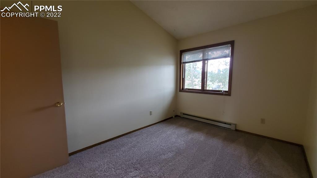 401 Forest Edge Road, Unit A8 Woodland Park, CO 80863 - Photo 13 of 17 a view of an empty room with a window