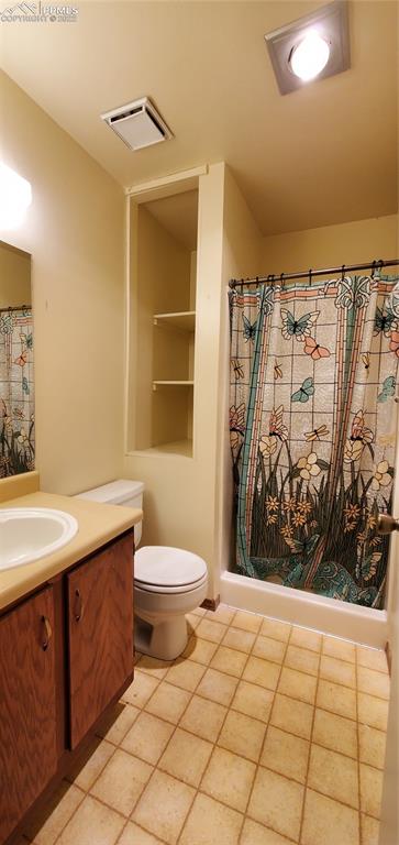 401 Forest Edge Road, Unit A8 Woodland Park, CO 80863 - Photo 14 of 17 a bathroom with a toilet sink and shower
