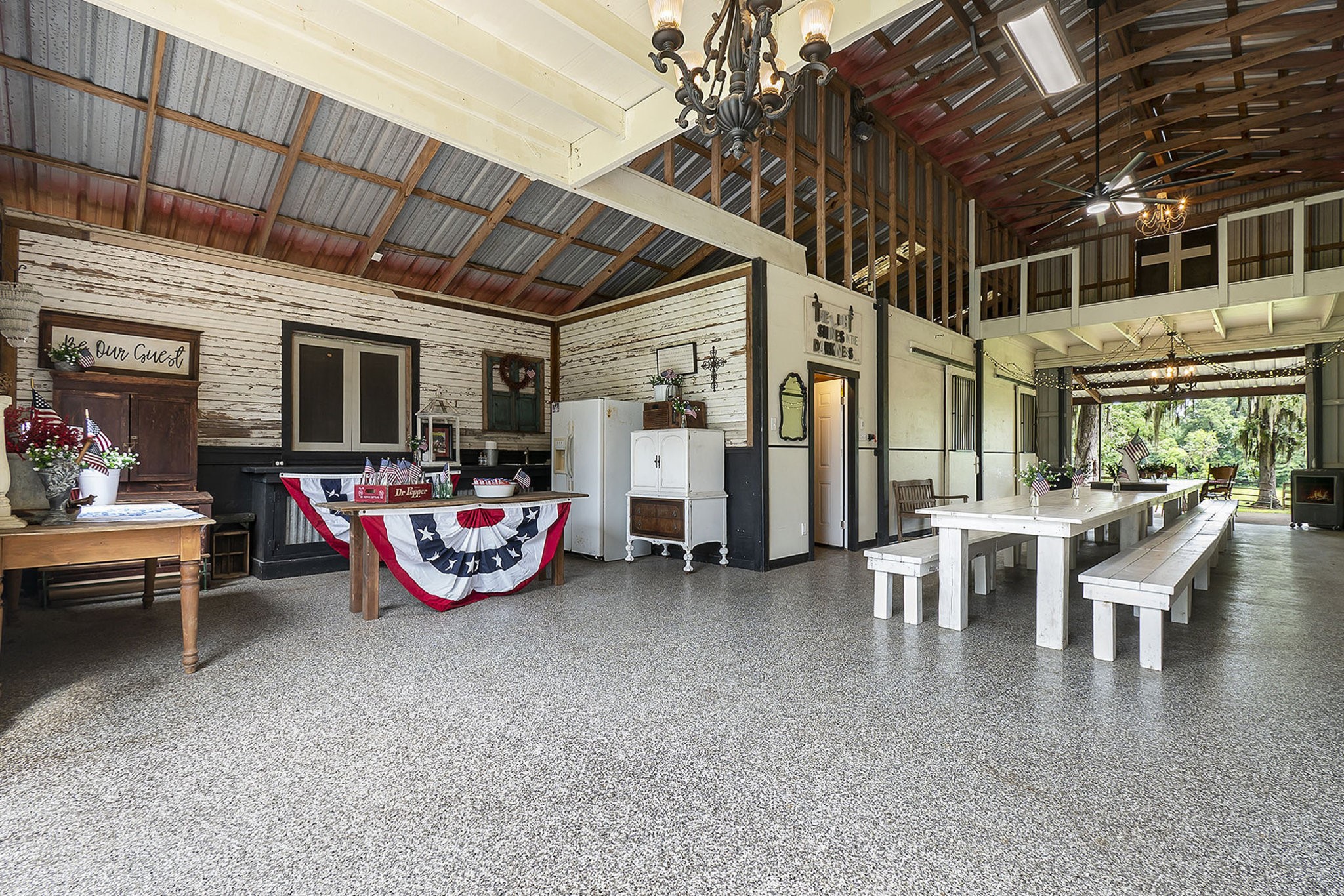 7363 County Line Road Willis, TX 77378 - Photo 30 of 34 Experience endless possibilities in this spacious barn, perfect for hosting unforgettable gatherings, weddings, and celebrations.