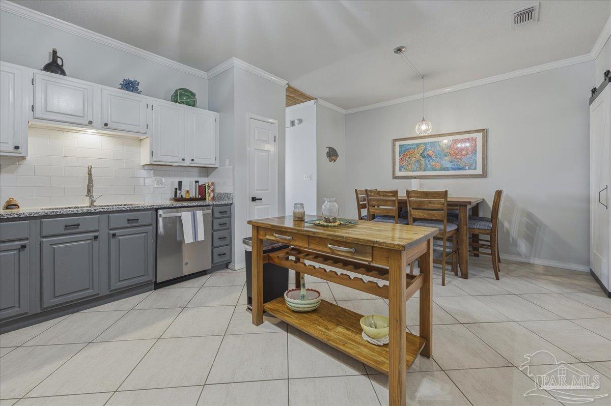 26063 Canal Road, Unit 3F Orange Beach, AL 36561 - Photo 32 of 72 a kitchen with a stove window and cabinets
