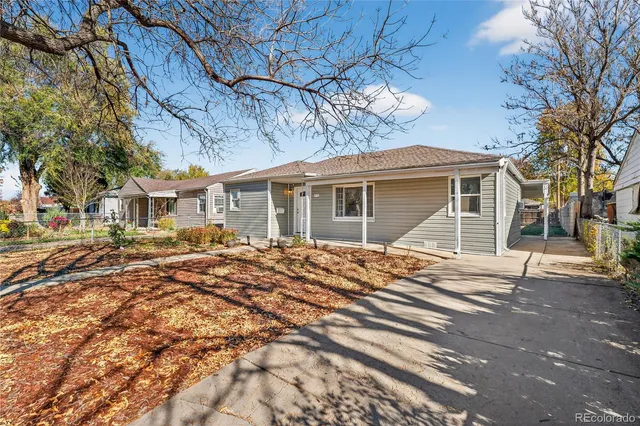 a view of a house with a snow in the yard