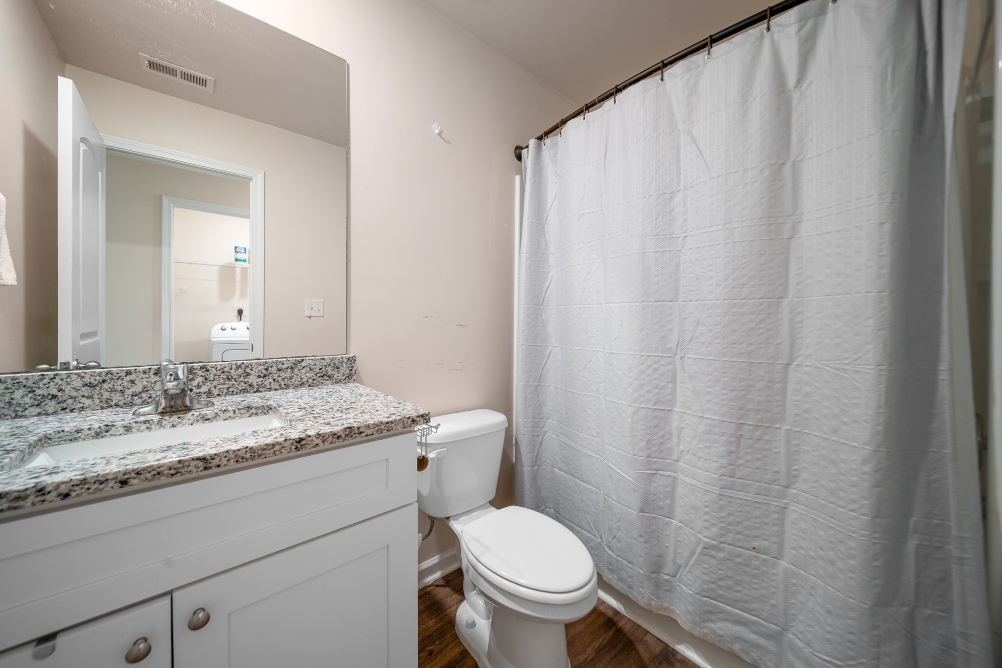307 Masters Way Dickson, TN 37055 - Photo 17 of 26 a bathroom with a granite countertop sink toilet and a mirror