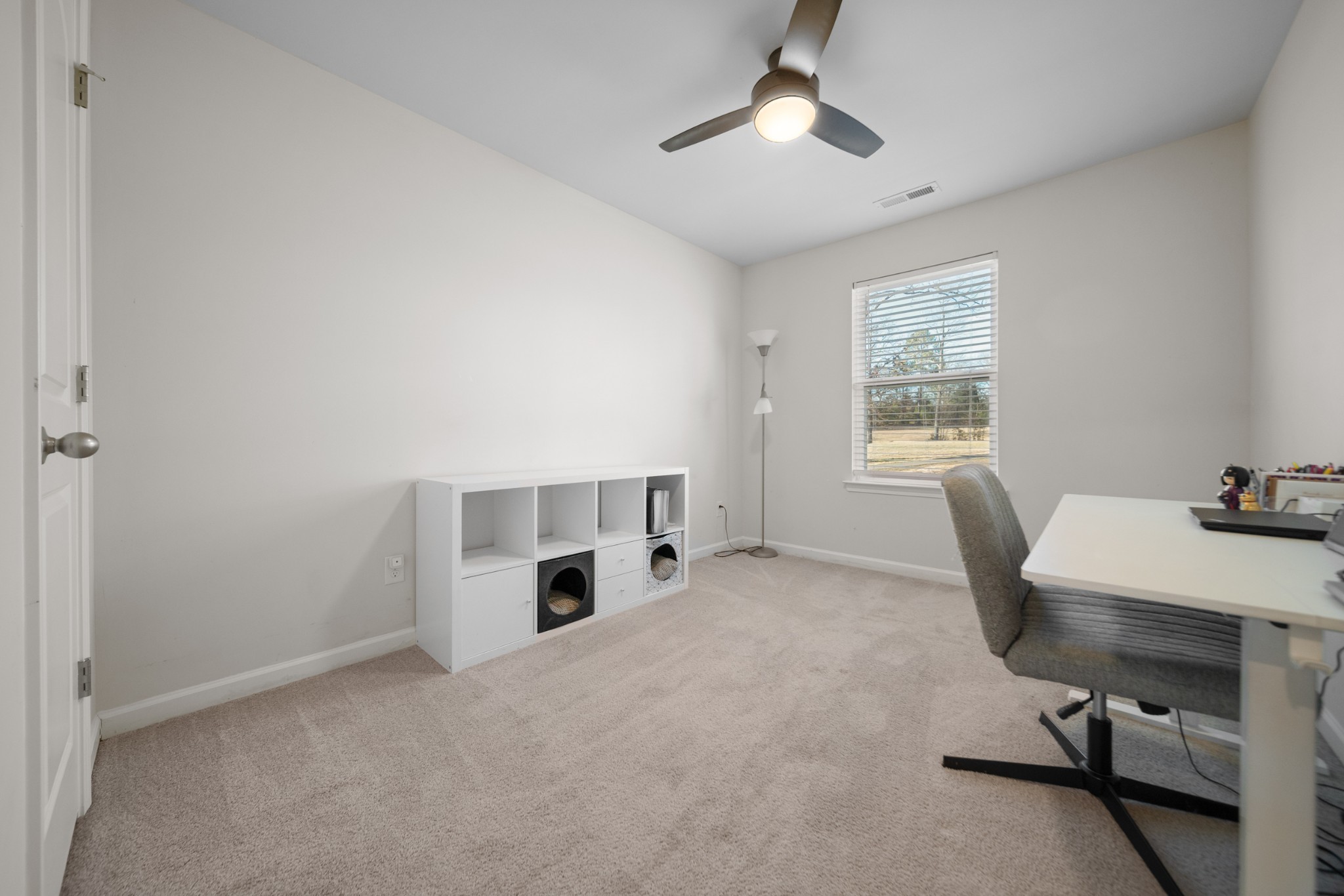 307 Masters Way Dickson, TN 37055 - Photo 19 of 26 a view of a workspace with furniture and a window