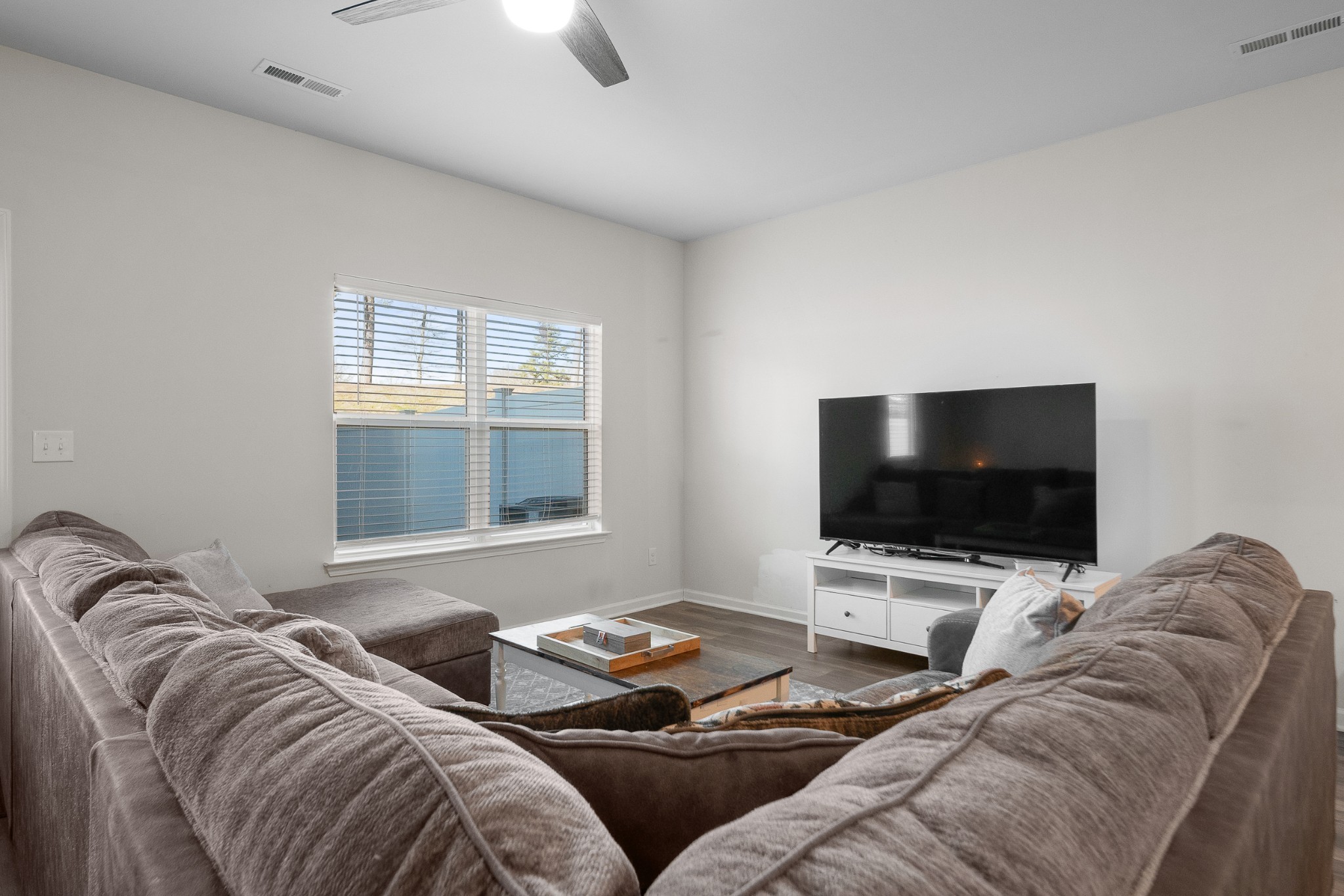 307 Masters Way Dickson, TN 37055 - Photo 6 of 26 a living room with furniture and a flat screen tv