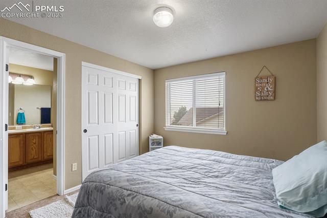 12130 Rio Secco Road Peyton, CO 80831 - Photo 29 of 40 Guest room with Jack and Jill bathroom