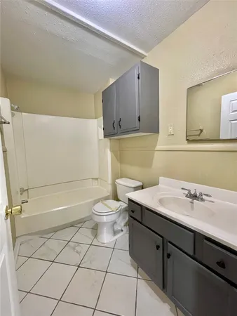 a bathroom with a sink toilet and vanity