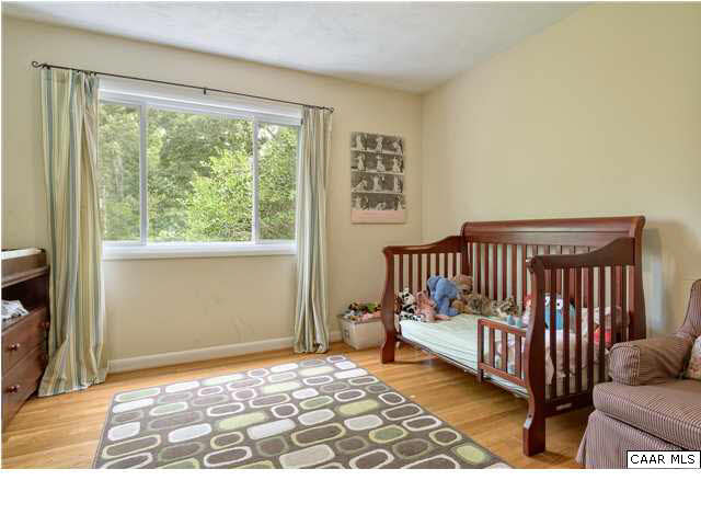 1711 Old Forge Road Charlottesville, VA 22901 - Photo 11 of 18 a bedroom with a bed and a window