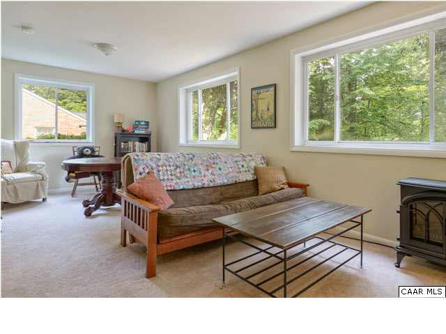1711 Old Forge Road Charlottesville, VA 22901 - Photo 13 of 18 a living room with furniture a window and a flat screen tv