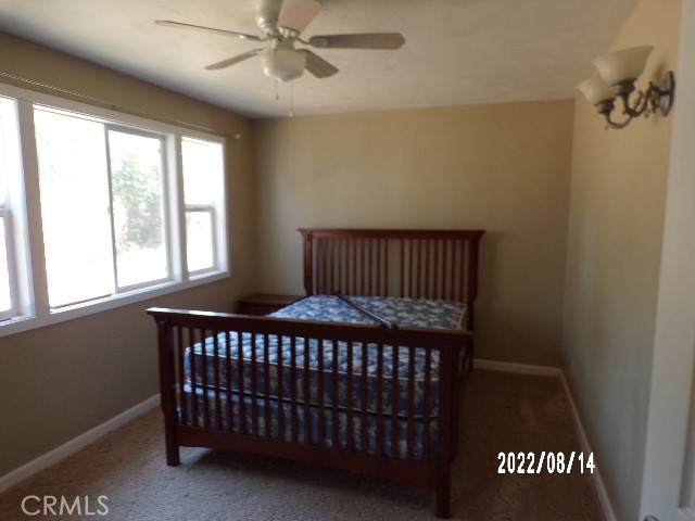 13425 Jensen Road Clearlake Oaks, CA 95423 - Photo 15 of 17 a bedroom with a bed and a window