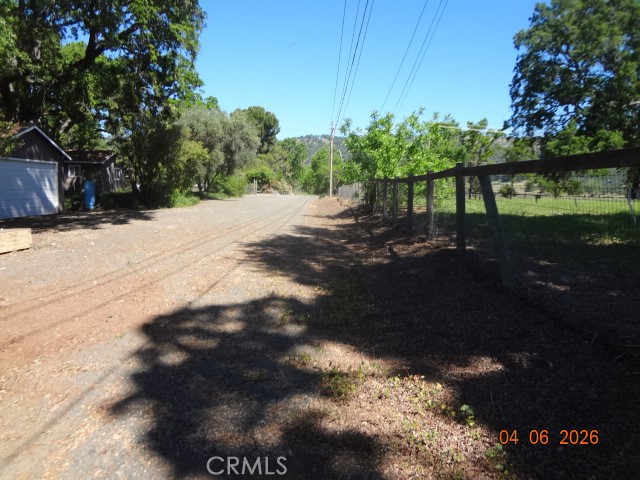 13425 Jensen Road Clearlake Oaks, CA 95423 - Photo 2 of 17 a view of a yard with a tree