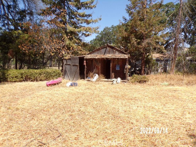 13425 Jensen Road Clearlake Oaks, CA 95423 - Photo 7 of 17 a front view of a house with a yard covered in snow