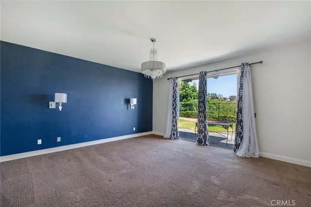 an empty room with windows and outdoor view