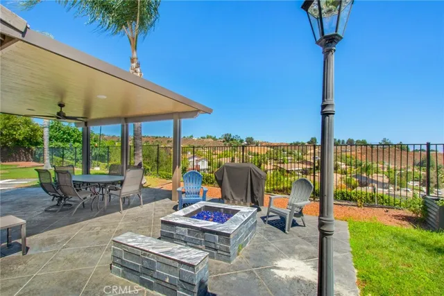 a building outdoor space with patio furniture and garden