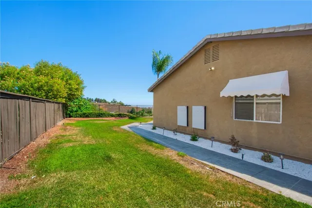 a backyard of a house with lots of green space