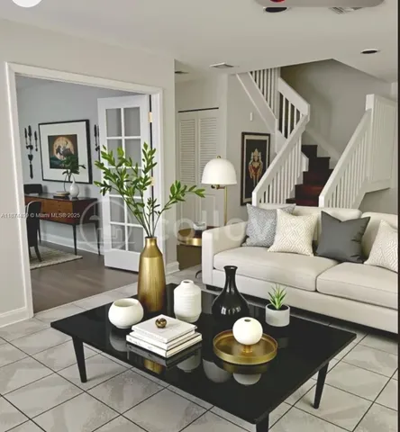 a living room with furniture and a table