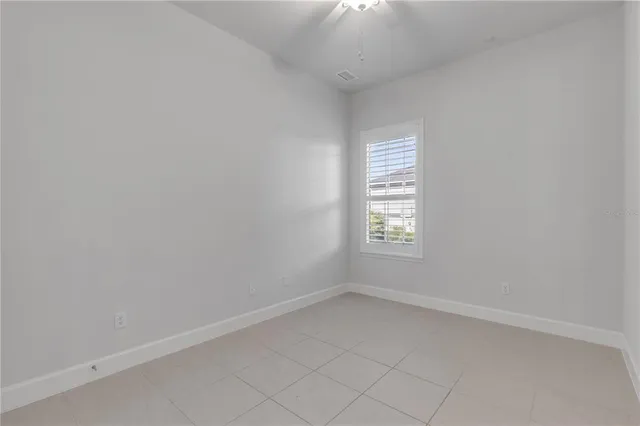 a bathroom with a granite countertop toilet sink and bathtub