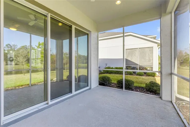 a front view of house with yard and swimming pool