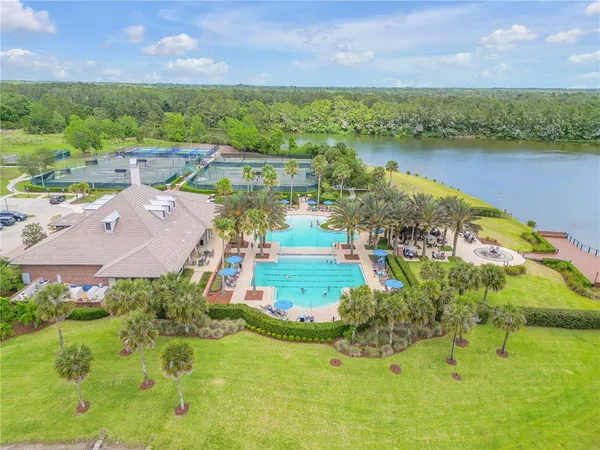 an aerial view of a house with a lake view