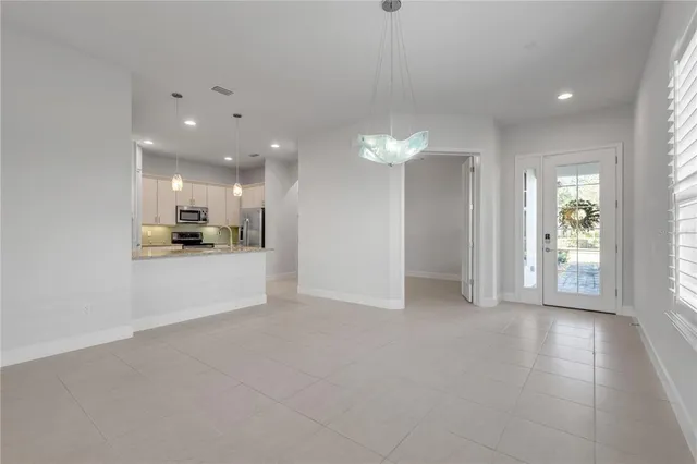 a view of a kitchen and a window