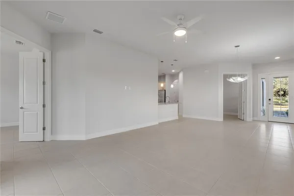 a large kitchen with a large counter top stainless steel appliances and cabinets