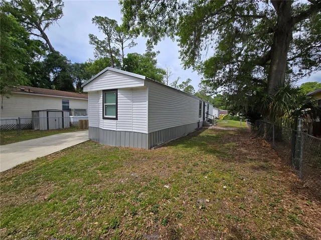 a house with trees in the background