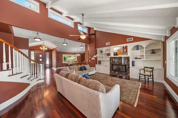 a large kitchen with kitchen island a large counter space and stainless steel appliances