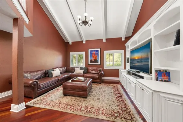 a large kitchen with stainless steel appliances and a large window