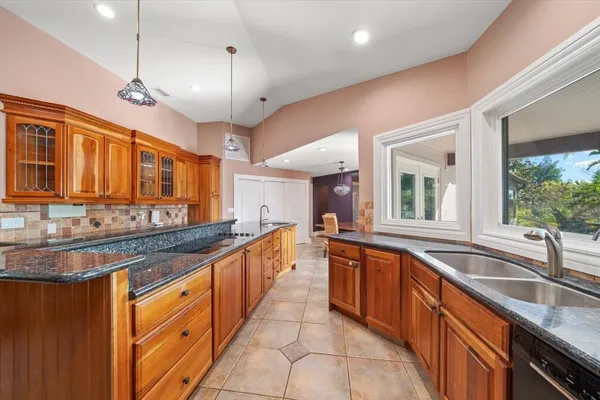 a large bathroom with a sink a large mirror and a shower