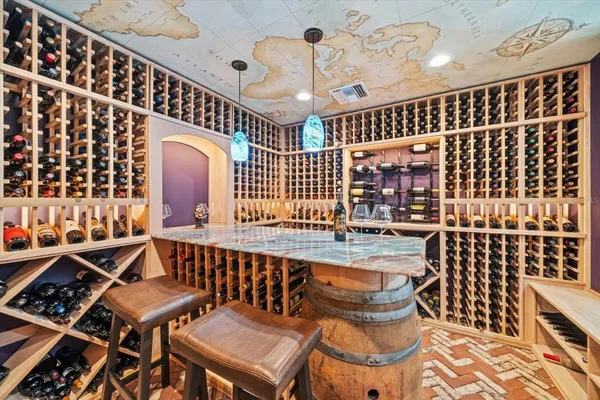 a bathroom with a granite countertop sink a toilet a mirror and shower