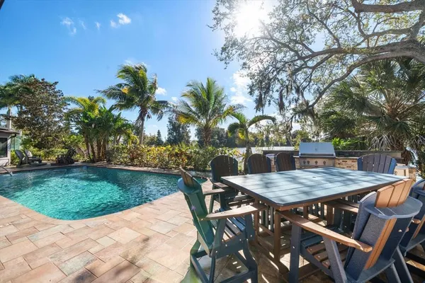 a bathroom with a sink a mirror and shower