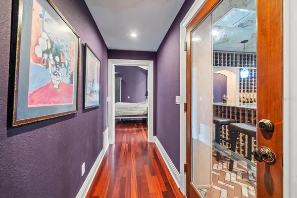 a bathroom with a toilet a sink a mirror and vanity