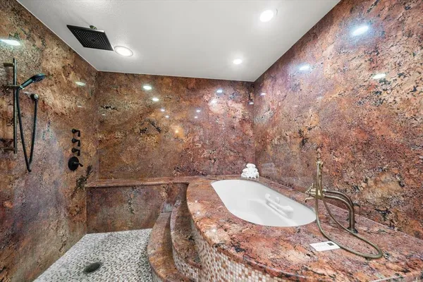 a view of swimming pool with a bench and trees in the background