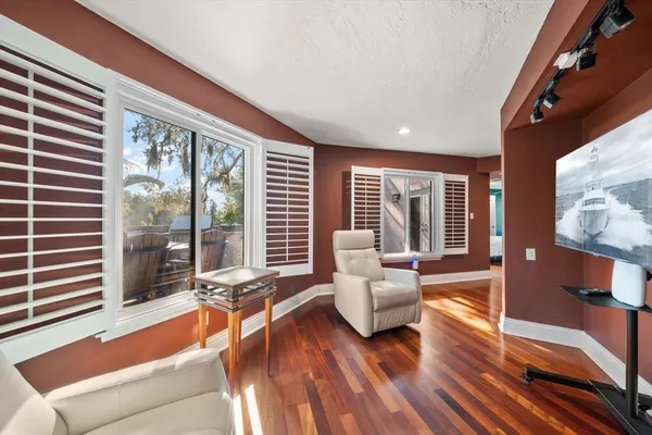 a view of residential houses with outdoor space and lake view