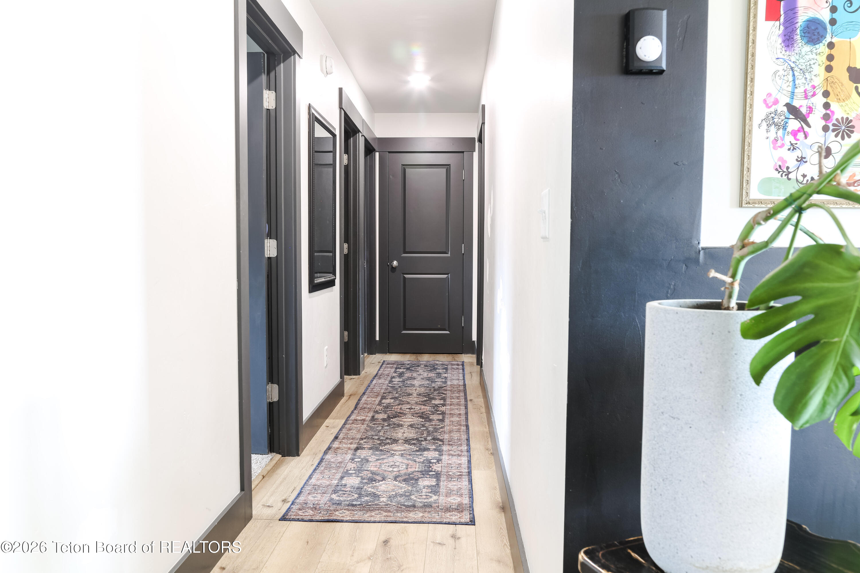 215 Little Greys Loop Etna, WY 83118 - Photo 11 of 20 Bed & Bath Hallway