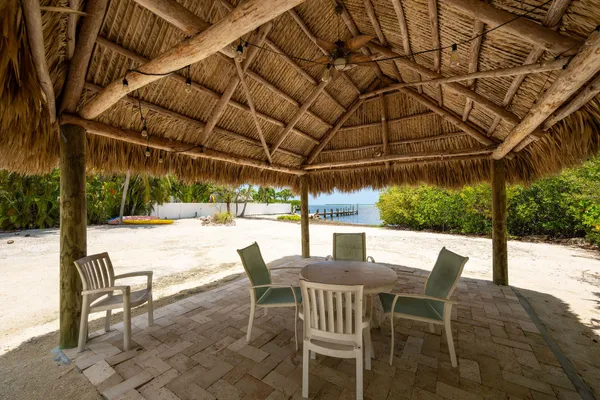 a spacious bedroom with a large bed and a large window