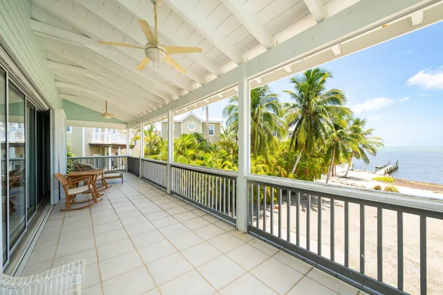 a bedroom with bed couch and window