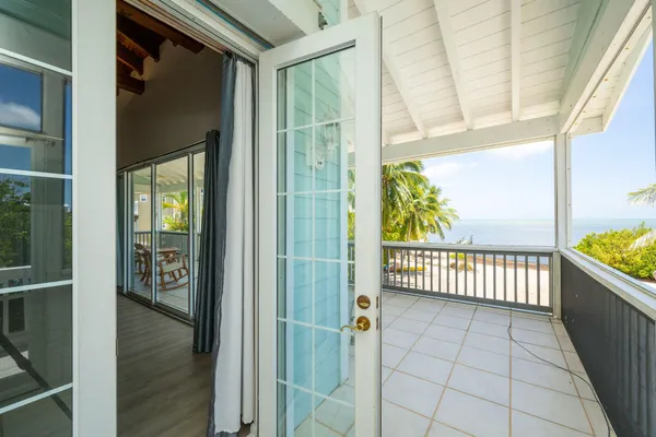 a bathroom with double vanity and a bathtub