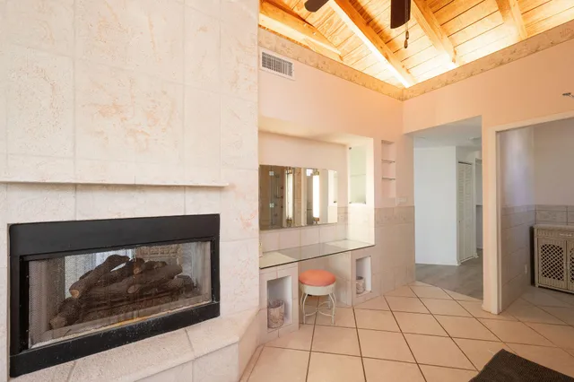 a bedroom with a bed and a television