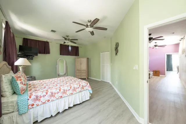 a view of a lake with a table and chairs