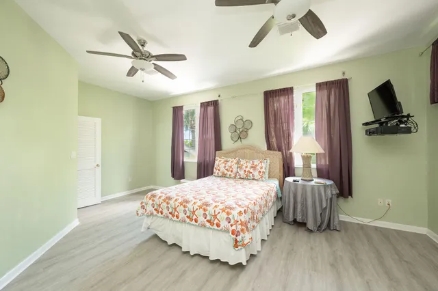 an aerial view of a house with a lake view