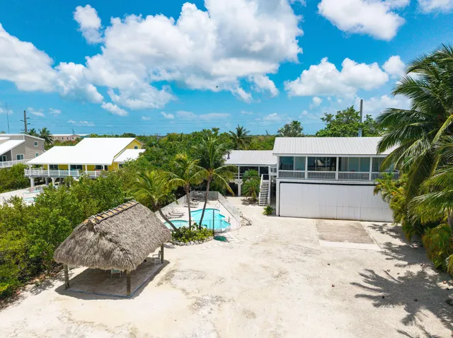 a swimming pool view with a lake view