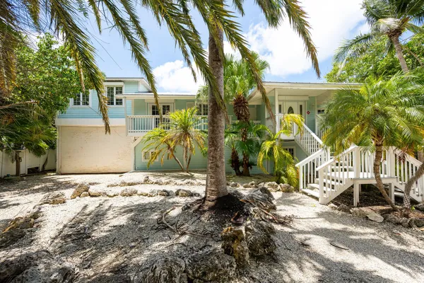 a view of a lake with houses in the back