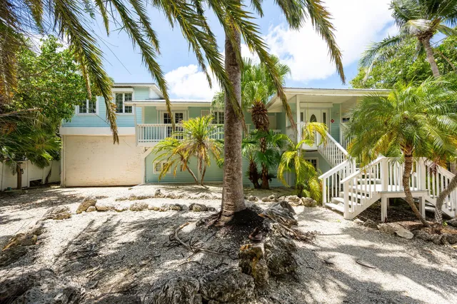 a view of a lake with houses in the back