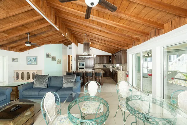 a living room with fireplace furniture and a floor to ceiling window