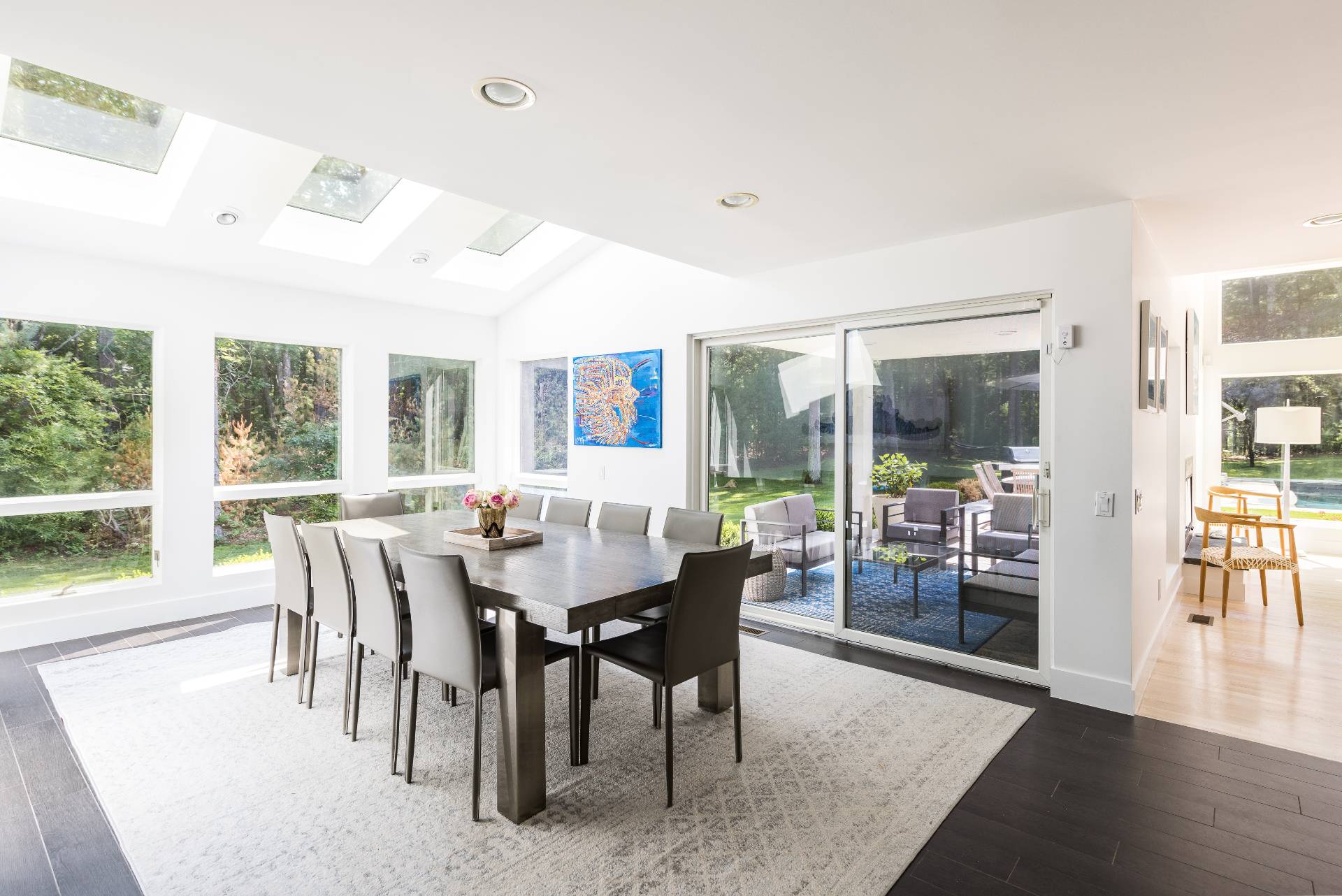 52 Bull Path East Hampton, NY 11937 - Photo 9 of 24 a view of a dining room with furniture window and wooden floor