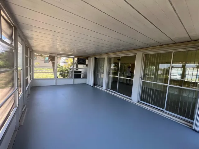 a view of empty room with floor to ceiling window